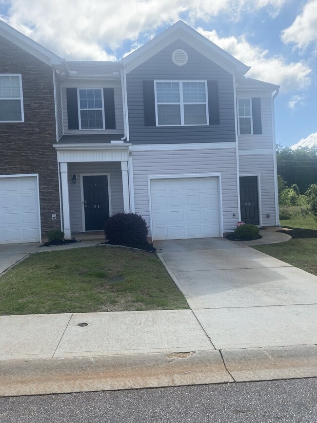 Building Photo - "Modern 3-Bedroom Multiplex with 3 Full Ba...