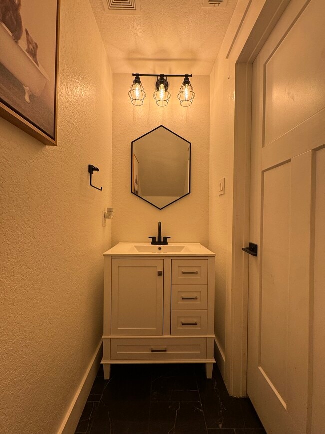 Downstairs half bathroom - 12710 Clearwater Cv