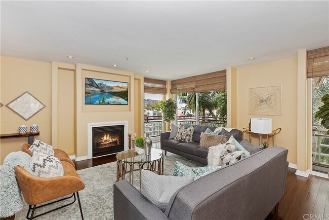 Living room with gorgeous views of the hills and hollywood sign - 131 N Croft Ave