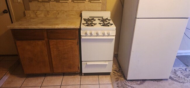 Counter, stove, oven, refrigerator - 5127 Temple Ct