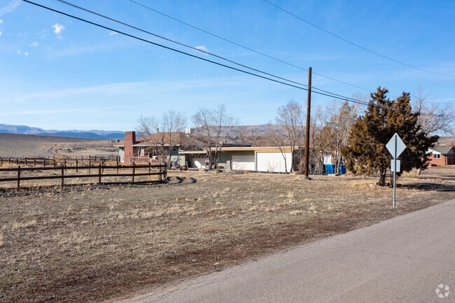 Split-level ranch houses on large lots with mountain views are a common sight in Bear Creek Lake Park.