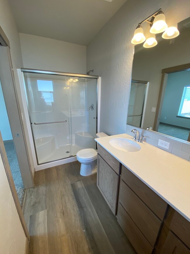 Primary Bathroom with walk in shower - Maplewood Villas