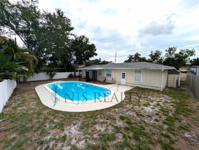Building Photo - Beautiful 4/2/2 home with a POOL, 1700 Sq. Ft. with fenced yard, TONS of renovations