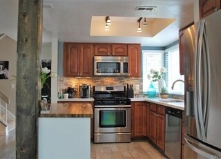 Open kitchen with stainless steel appliances - 2994 Brandon Cir