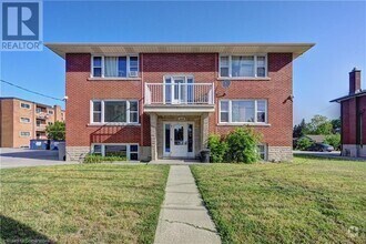Building Photo - 1230 Queen's Blvd