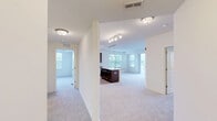 Located at 200 Hudson Ct in Wheeling, IL, this well-appointed 2-bedroom, 2-bathroom residence offers a thoughtfully designed single-level floor plan that maximizes both comfort and functionality. The open-concept kitchen and living area serves as the heart of the home, featuring rich dark-wood cabinetry, gleaming granite countertops, stainless steel appliances including a refrigerator, gas range, and built-in microwave, and light hardwood flooring. A kitchen island provides additional prep and dining space, while track lighting illuminates the room effectively. The spacious living room is bathed in natural light through multiple large windows and a sliding glass door that opens directly onto a private balcony with outdoor views. Both bedrooms are carpeted and generously sized, with the primary bedroom offering closet storage and its own access to an en-suite bathroom. The second bedroom features a large window overlooking the surrounding greenery. Each bathroom is finished with granite vanity tops, dark wood cabinetry, and tile flooring, with one bathroom offering a full tub-shower combination. A dedicated utility room and connecting hallway complete the layout, adding practical everyday convenience to this comfortable Wheeling residence.