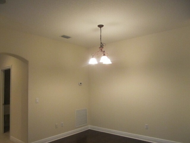 Building Photo - PRISTINE 3/2 one story home in gated commu...