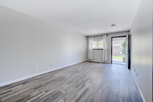 LIVING ROOM (VIEW FROM THE KITCHEN) - Madison Place Boutique Apartments