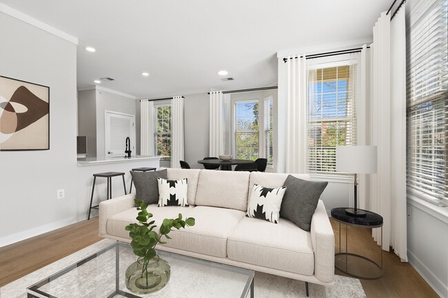 Renovated Package II dining and living room with hard surface flooring - Avalon Falls Church