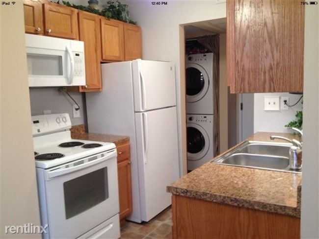 Washer and dryer off kitchen - 832 Bloomfield Village Blvd