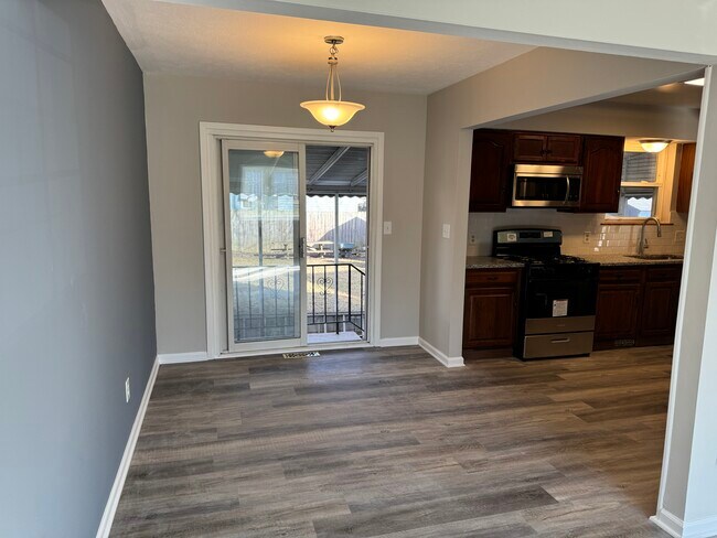 Dining room next to kitchen, looking towards screened-in porch - 32953 Alva Dr