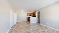 Located at Hartford Village in Columbus, Ohio, this 2-bedroom, 1-bathroom single-floor residence offers a practical and comfortable layout. The open-concept living and dining area flows seamlessly into the kitchen, which features warm honey-toned cabinetry, granite-style countertops, a full suite of black appliances including a range, microwave, and refrigerator, and durable light wood-style flooring throughout. A peninsula counter creates a natural division between the kitchen and living space, adding both function and definition to the layout.

The living room is bright and welcoming, with neutral gray walls, clean white trim, and a window that allows natural light to fill the space. Both bedrooms are well-sized, with the primary bedroom offering plush carpeting, a dedicated closet, and a walk-in closet with wire shelving for ample storage. The second bedroom also features light wood-style flooring and a window with blinds.

The full bathroom includes a single-sink vanity with matching cabinetry and granite-style countertop, a tub/shower combo, and light flooring. Additional highlights include an in-unit laundry area and a hallway connecting all rooms efficiently. The consistent neutral palette and clean finishes throughout create a cohesive, move-in-ready living environment.
