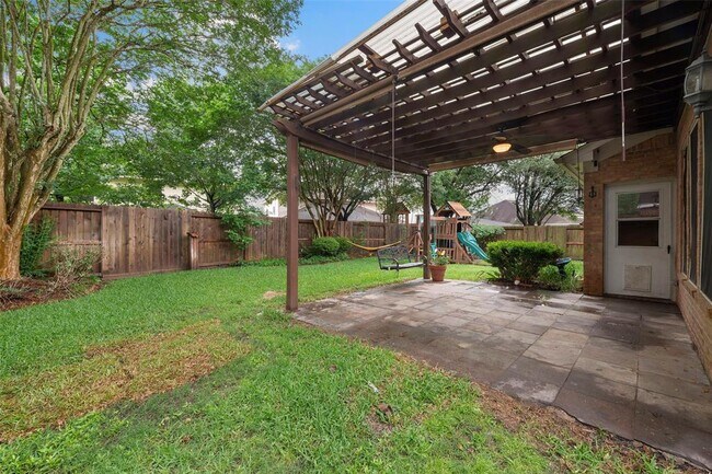 covered patio with swing and playset - 6519 Belmont Bnd