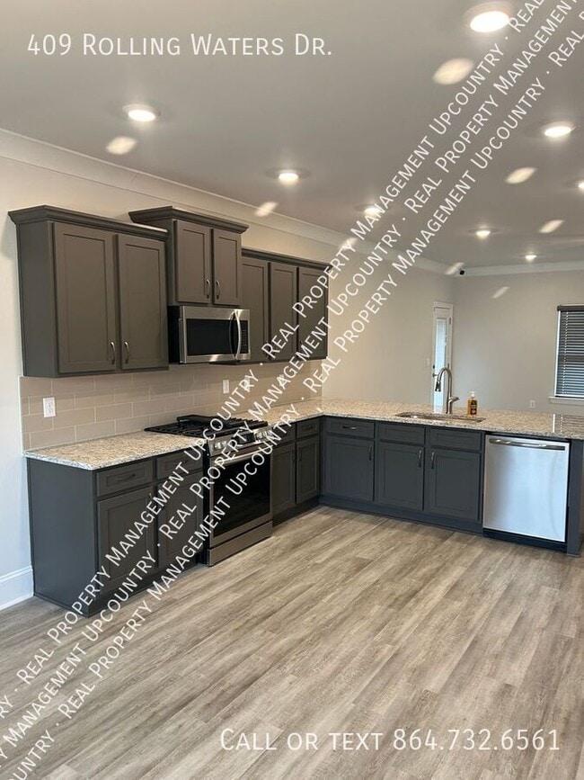 Foto del edificio - 409 Rolling Waters Dr