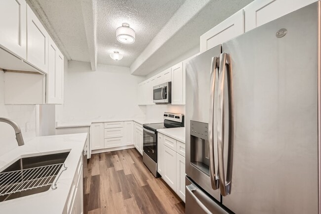 Building Photo - Completely Updated 2 Bedroom 2 Bathroom Condo Available NOW! Garage Parking Included!