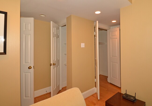 2 shelved closets on left and 1 large wardrobe closet right - 1577 N Colonial Ter