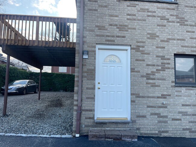 Back door entrance near Garage and spacious parking lot - 2442 1st St