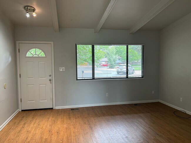 Building Photo - Spacious Fort Collins Rental with Hardwood Floors & Flex Space
