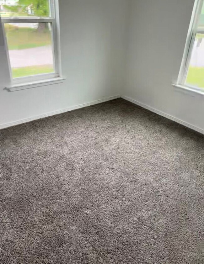 Photo - Black house on a hill