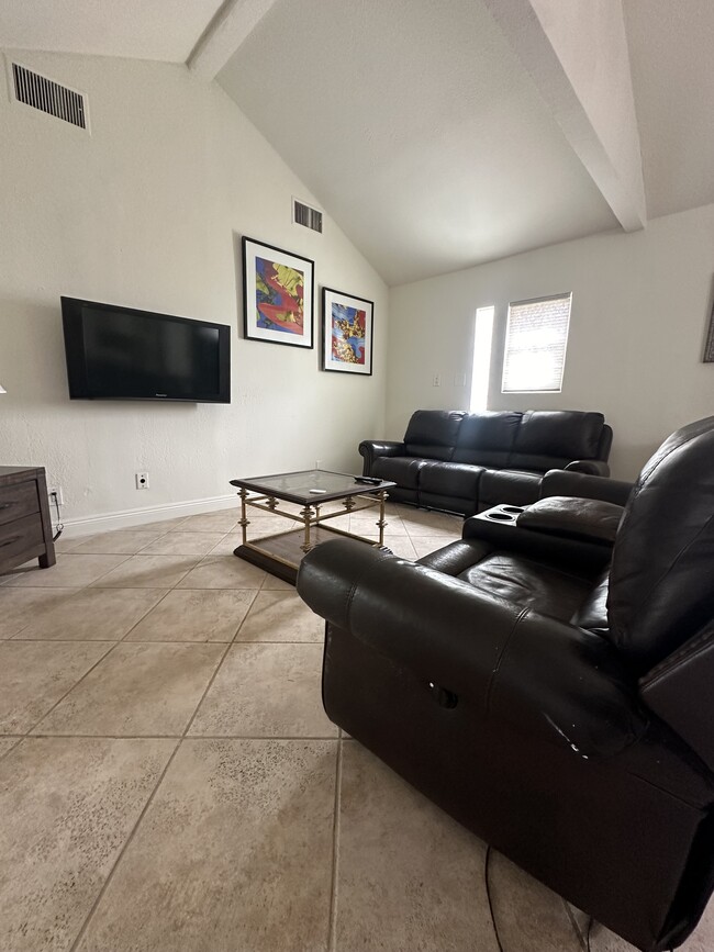 High ceiling living room. - 7403 Vanalden Ave