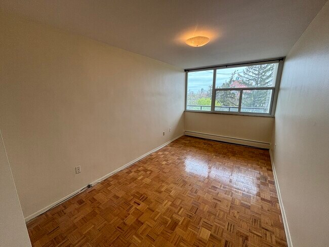 Building Photo - 1061 Queen's Blvd