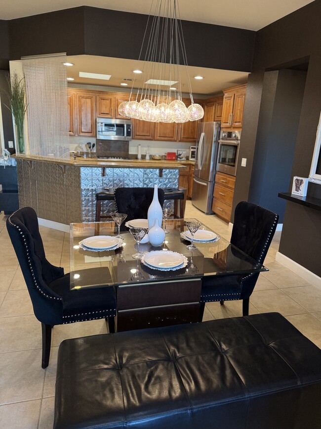 Upscale Fully Furnished 3 Bedroom Condo Kitchen and Dining Area - 83 E Agate Ave