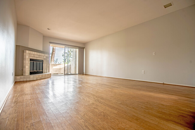 view of the livingroom/patio (the hardwood floors have been refinished since this photo was taken) - 4859 Bella Pacific Row