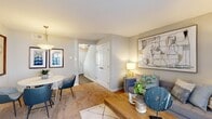 Located at 4100 Townhouse Road in Richmond, VA, this two-story home offers a practical and thoughtfully designed layout spread across two floors. The main level features a combined living and dining area with warm wood-tone flooring, a sliding glass door that fills the space with natural light, and a seamless flow between gathering areas. The dining space is accented by a stylish pendant light and framed artwork. The kitchen is well-equipped with stainless steel appliances, white shaker cabinetry, granite-style countertops, and a bright window overlooking the outdoors. A convenient louvered bi-fold closet door provides additional storage near the kitchen. Upstairs, the primary bedroom offers a calm retreat with soft carpet, a muted accent wall, and tasteful décor. The second bedroom features a natural light-filled window with outdoor views and a flexible layout suitable as a guest room or home office. The full bathroom is finished with wood-look tile flooring, a white vanity, and a bathtub. A hallway connects the upper-level rooms, completing a cohesive and efficient floor plan ideal for comfortable everyday living.