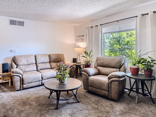 Living Room With Large Window - Country Green Apartments