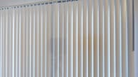 This two-storey space is equipped with vertical window blinds, as seen in the image provided. The blinds are a clean, off-white tone and are mounted on a ceiling track, offering full coverage across the window width. This style of window treatment allows for flexible light management, enabling occupants to adjust natural light levels and maintain privacy as needed. The warm neutral wall tones visible behind the blinds suggest a bright, understated interior palette. Beyond this detail, limited information is available to provide a comprehensive description of the full layout, room configuration, or architectural features of each floor.