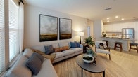This thoughtfully designed single-floor residence offers a cohesive blend of modern aesthetics and functional living. The open-concept living area is anchored by light hardwood-style flooring, large windows that invite abundant natural light, and neutral wall tones that create a calm, welcoming ambiance. The living room provides generous space for seating arrangements and is complemented by a connected dining area, making it ideal for both everyday living and entertaining.

The kitchen is a standout feature, outfitted with crisp white shaker cabinetry, dark countertops, a classic subway tile backsplash, and a full suite of stainless steel appliances. Light flooring and recessed lighting add to its bright, clean character.

Three well-proportioned bedrooms each offer plush carpeting, ample closet space, and large windows with outdoor views. The primary bedroom is complemented by a private en-suite bathroom featuring a single vanity with dark countertops, a lighted mirror, and a glass-enclosed walk-in shower. A second full bathroom includes a soaking tub with white tile surround, a dark-topped vanity, and wood-look tile flooring.

Throughout the residence, a consistent palette of soft neutrals, modern fixtures, and carefully considered finishes creates a refined yet approachable atmosphere suited to a wide range of lifestyles.