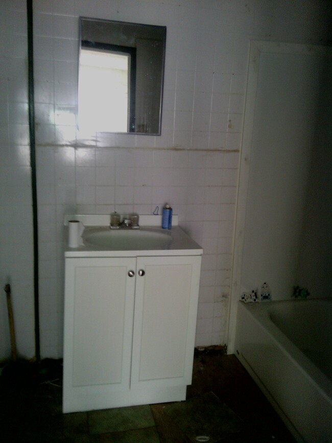 view of bathroom sink from fireplace room - 110 Dowdy St