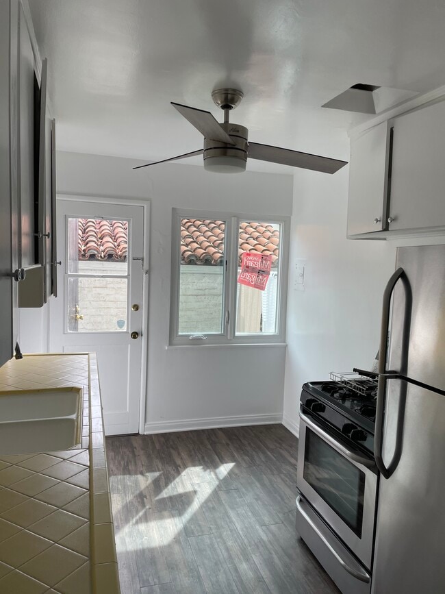 Patio off kitchen. New Milgard high end windows throughout unit. - 1477 Havenhurst Dr