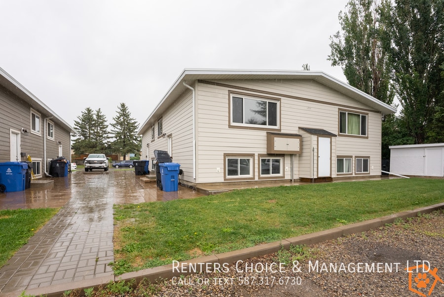 Primary Photo - Spacious & Updated 4-Plex Unit with Lawn C...