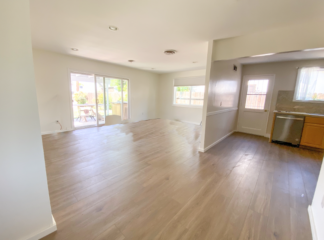 Living room with sliging door to patio - 23329 Victory Blvd