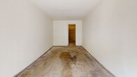 Located at 854 Vine St in Oceanside, California, this single-floor space consists of a garage and an adjoining room. The garage features a standard roll-up overhead door with an automatic opener track, offering direct access to the driveway and street beyond. The interior is finished with smooth white walls and a concrete floor, providing a clean, functional layout suitable for vehicle storage or a workshop setting. Natural light filters in through the open garage door, offering views of the surrounding greenery outside. Attached to the garage is a secondary room accessible through a doorway, distinguished by its exposed cinder block wall construction. This additional space shares the same concrete flooring and white-painted walls, making it a versatile area that could serve as storage, a utility room, or a workspace. The straightforward, utilitarian design of the overall space prioritizes functionality, with clean lines and minimal detailing throughout. The layout and construction suggest a solid, durable build well-suited for a variety of practical uses in the Oceanside, CA area.