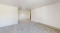 Located at 3715 W 123rd Pl in Alsip, Illinois, this single-floor residence offers 2 bedrooms and 2 bathrooms within a thoughtfully laid-out floor plan. The living room is bright and open, featuring plush wall-to-wall carpeting, a baseboard heating system, and sliding glass doors that lead directly to a private balcony overlooking a tree-lined courtyard shared with the surrounding community. The dining area flows naturally from the living space, creating a cohesive gathering zone. The kitchen is well-equipped with rich dark-stained cabinetry, granite-style countertops, a double-basin sink, and tile flooring, offering ample storage and counter space. Both bedrooms are carpeted and finished in neutral tones, with windows that bring in natural light and views of the exterior grounds; each room includes baseboard heating. The primary bedroom is generously sized and features a dedicated closet with slatted bi-fold doors. The bathrooms are cleanly finished, with one showcasing a walk-in shower enclosed by sliding glass doors and stone-style tile surround, complemented by granite-top vanities and light tile flooring. Four closets throughout provide excellent storage. The overall ambiance is clean, neutral, and move-in ready.