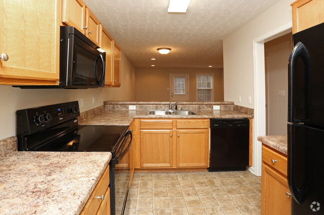 01 2BR, 1.5BA - 1,000 SF - Townhome With Garage - Kitchen - Upper and Lower Stone Apartments