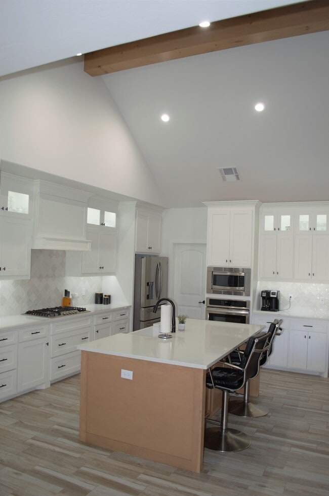 Kitchen with large island and tons of cabinetry - 12340 Memory Ln