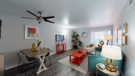 This single-floor residence offers a thoughtfully designed layout that balances comfort and functionality. The open-concept living and dining area serves as the heart of the home, featuring wood-style plank flooring, neutral walls, and a ceiling fan overhead. A large sliding glass door floods the space with natural light and provides access to an outdoor area, while vertical blinds offer privacy when desired. The dining area accommodates a full-sized table, making it ideal for everyday meals or entertaining.

The galley-style kitchen is efficiently arranged with white cabinetry, gray countertops, and stainless steel appliances, including a dishwasher and range. A window above the sink brings in additional natural light, and the wood-style flooring continues seamlessly throughout.

The bedrooms are carpeted for warmth and comfort, each offering a calm, neutral atmosphere with natural light from well-placed windows. One bedroom features a convenient en-suite bathroom. The bathroom is cleanly finished with a white vanity, dark countertop, a large mirror, and wood-style flooring, creating a tidy and functional space.

Overall, the residence presents a cohesive, move-in-ready aesthetic with a light color palette, practical finishes, and a layout designed for easy everyday living.