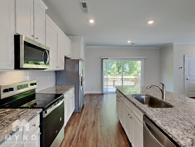 Building Photo - 6937 Woodland Stream Pl