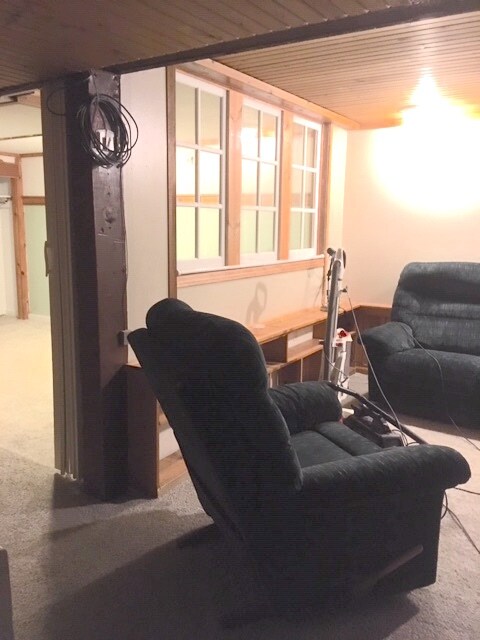 Living rm with built in cabinets & Furniture windows between bedroom & living rm - 22 W Bloomingdale St