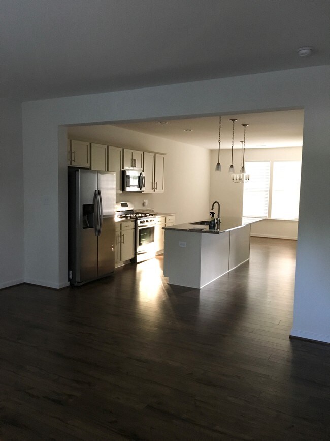 Kitchen and downstairs - 7504 Vinca Ct