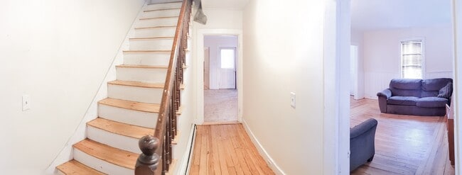 Stairs to 2nd floor, kitchen, and to the right is the living room - 1602 E Main St