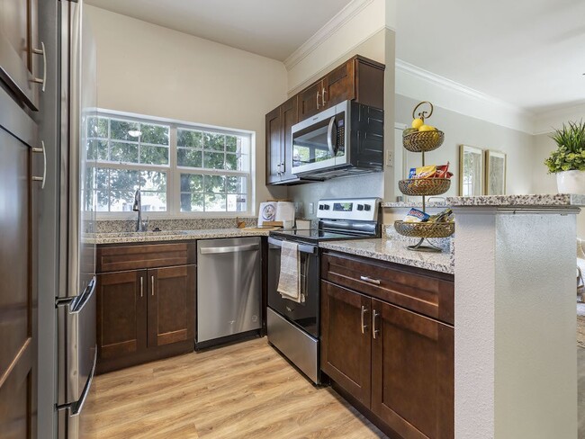 Kitchen with Steel Appliances - Pinehurst Apartments