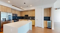 This contemporary 1140 square foot apartment in Atlanta offers a harmonious blend of style and functionality. The space boasts two bedrooms, including a spacious 170 square foot primary bedroom, and two well-appointed bathrooms. The open-concept design seamlessly integrates the kitchen and living room, creating an expansive feel.

The apartment features sleek hardwood flooring throughout, complemented by crisp white walls that enhance the sense of space and light. Large windows in the bedrooms provide stunning city views and ample natural light. The modern kitchen is a standout feature, with light wood cabinetry, stainless steel appliances, and a contrasting dark backsplash.

Both bathrooms showcase modern fixtures, including a floating vanity with ample storage and illuminated mirrors. The bedrooms are equipped with built-in closets, offering generous storage solutions. The apartment also includes additional closet spaces for maximum organization.

The overall design aesthetic is clean and minimalist, with attention to detail evident in features like recessed lighting and sleek hardware. This well-designed apartment offers a perfect balance of comfort and urban sophistication in the heart of Atlanta.