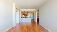 Located along the vibrant McKinney Avenue corridor in Dallas, TX, this one-bedroom, two-bathroom residence offers a thoughtfully designed single-floor layout. Warm hardwood flooring flows throughout the main living areas, complemented by crown molding and neutral tones that create a clean, modern aesthetic.

The open-concept living and dining area is bright and generously proportioned, anchored by the peninsula kitchen, which features dark granite countertops, warm wood cabinetry, stainless steel appliances, and stylish pendant lighting. The layout promotes seamless interaction between the kitchen, dining, and living spaces.

The bedroom is well-sized and finished with plush carpet and natural light from large windows that frame views of the Dallas skyline. Two closets provide ample storage throughout the unit.

Both bathrooms are finished with wood-toned cabinetry and clean fixtures. One bathroom includes a soaking tub with full tile surround and recessed lighting. A dedicated laundry room with in-unit washer hookups adds everyday convenience.

The space is rounded out by a dining area and two closets, ensuring practical storage solutions. This residence combines modern finishes with functional design in one of Dallas's most walkable and sought-after neighborhoods.