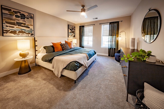 Spacious secondary bedroom with room for king-size furniture, oversized windows for abundant natural light, and privacy shades included in every apartment home. - Madison at Greenwood