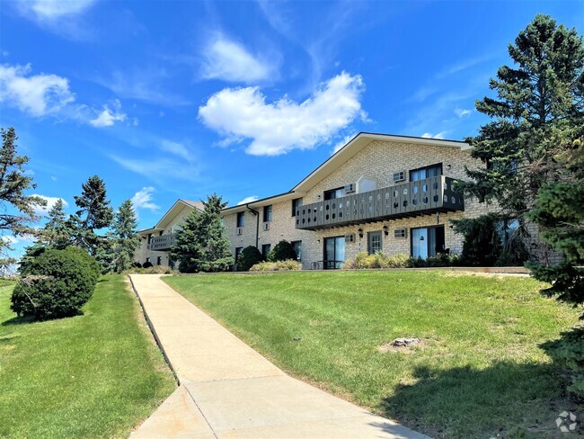 West side of property offers walkways with prairie views and greenspace - Central Park Apartments