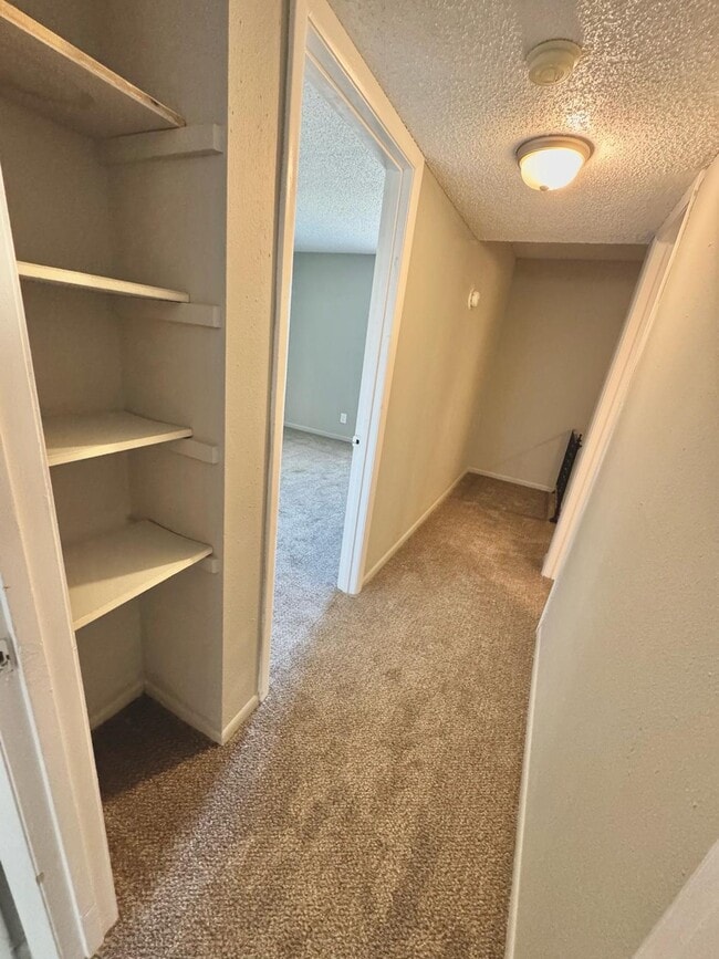 Upstairs Hall Looking Into Smaller Bedroom - Willow Creek Apartments